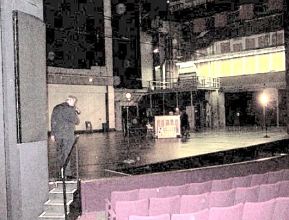 On the huge stage was a simple upright piano.