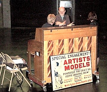 In front of the piano was an old poster that says, Artists Models, a stage extravaganza.