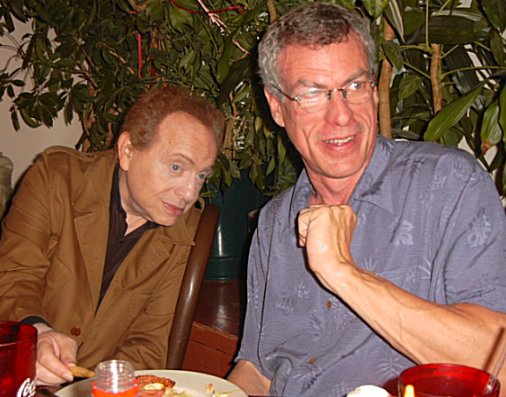 Jackie Mason steals a french fry from composer Steve Schalchlin.
