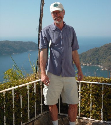 Steve standing in front of beautiful bay