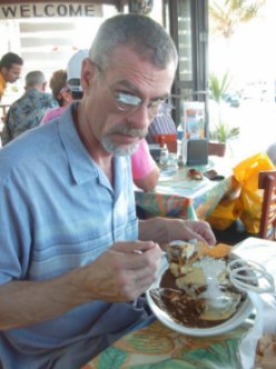Steve Schalchlin eating chicken mole in cozumel mexico